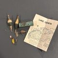 Vintage Fishing Memorabilia Miscellaneous Fishing Lures, Antique Bobbers, Bait Tin and Guide Map